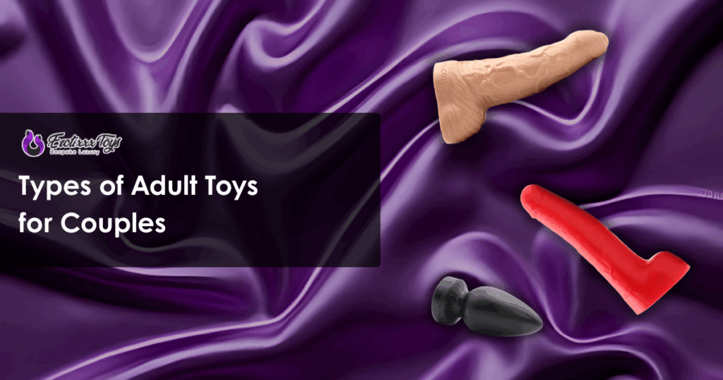 Diverse adult toys, including a flesh-tone dildo, red dildo, and black plug, on purple silk, Erotixxx Toys couples collection